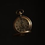 gold and silver pocket watch