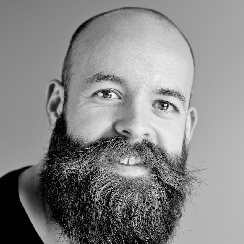 grayscale photography of man wearing crew-neck shirt