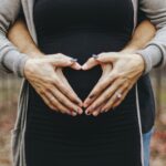 woman touching baby bump